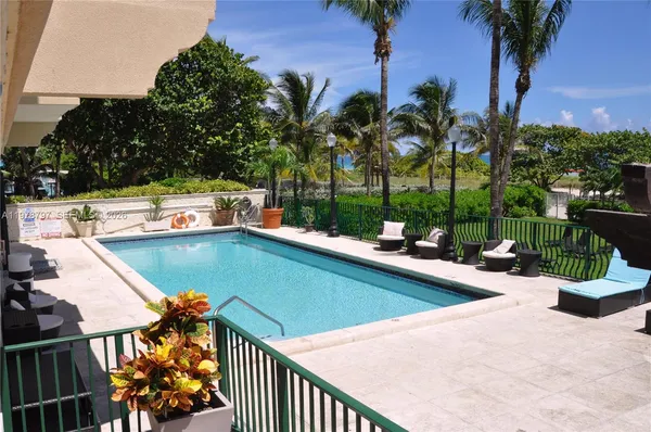 a view of swimming pool with chairs
