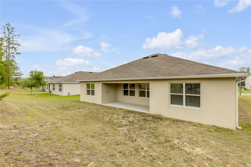 48 Hickory Loop Ocala, FL 34472 - Photo 45 of 52 a view of a house with a backyard