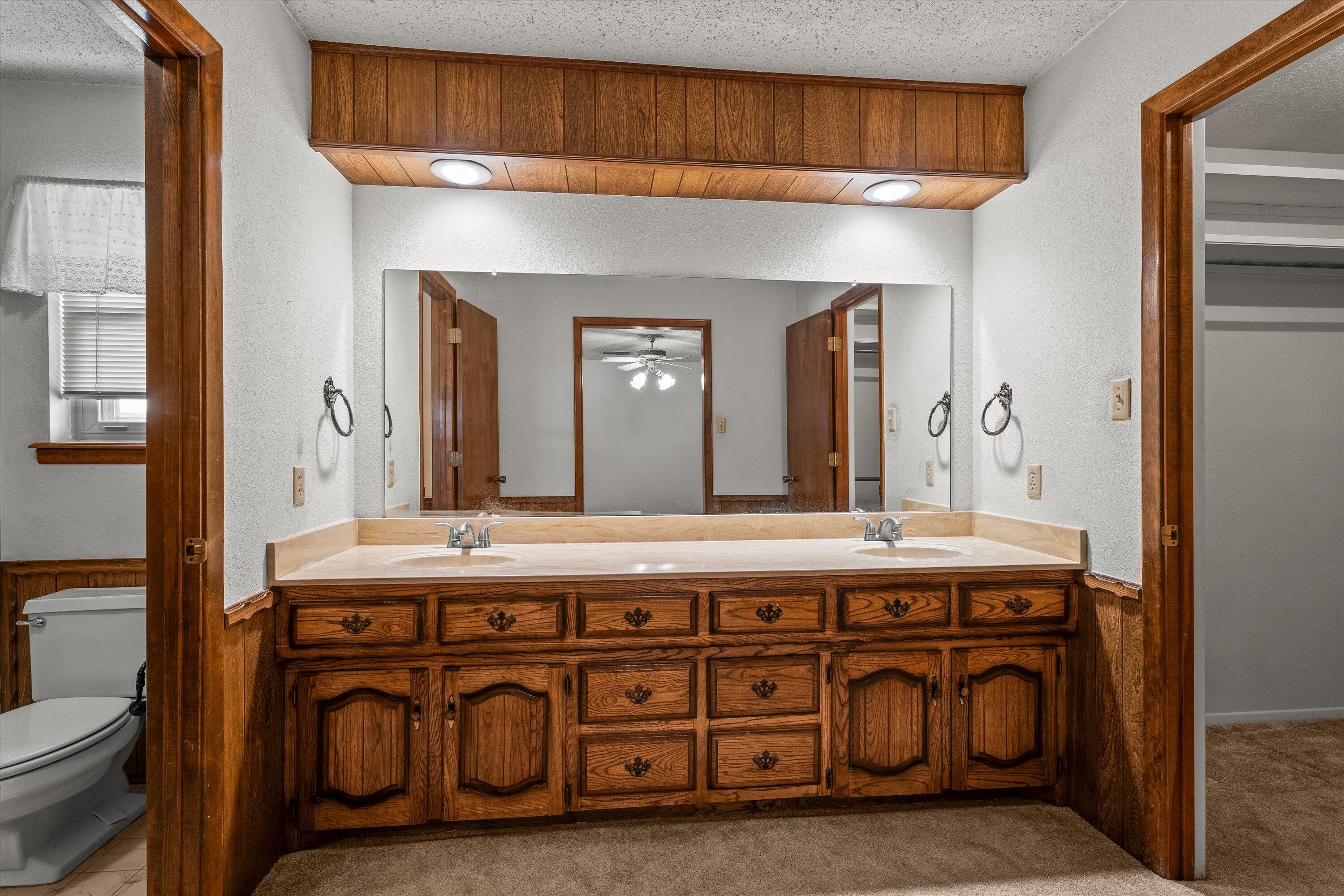 308 West 6th Street Sundown, TX 79372 - Photo 15 of 33 a bathroom with a sink a vanity and a mirror