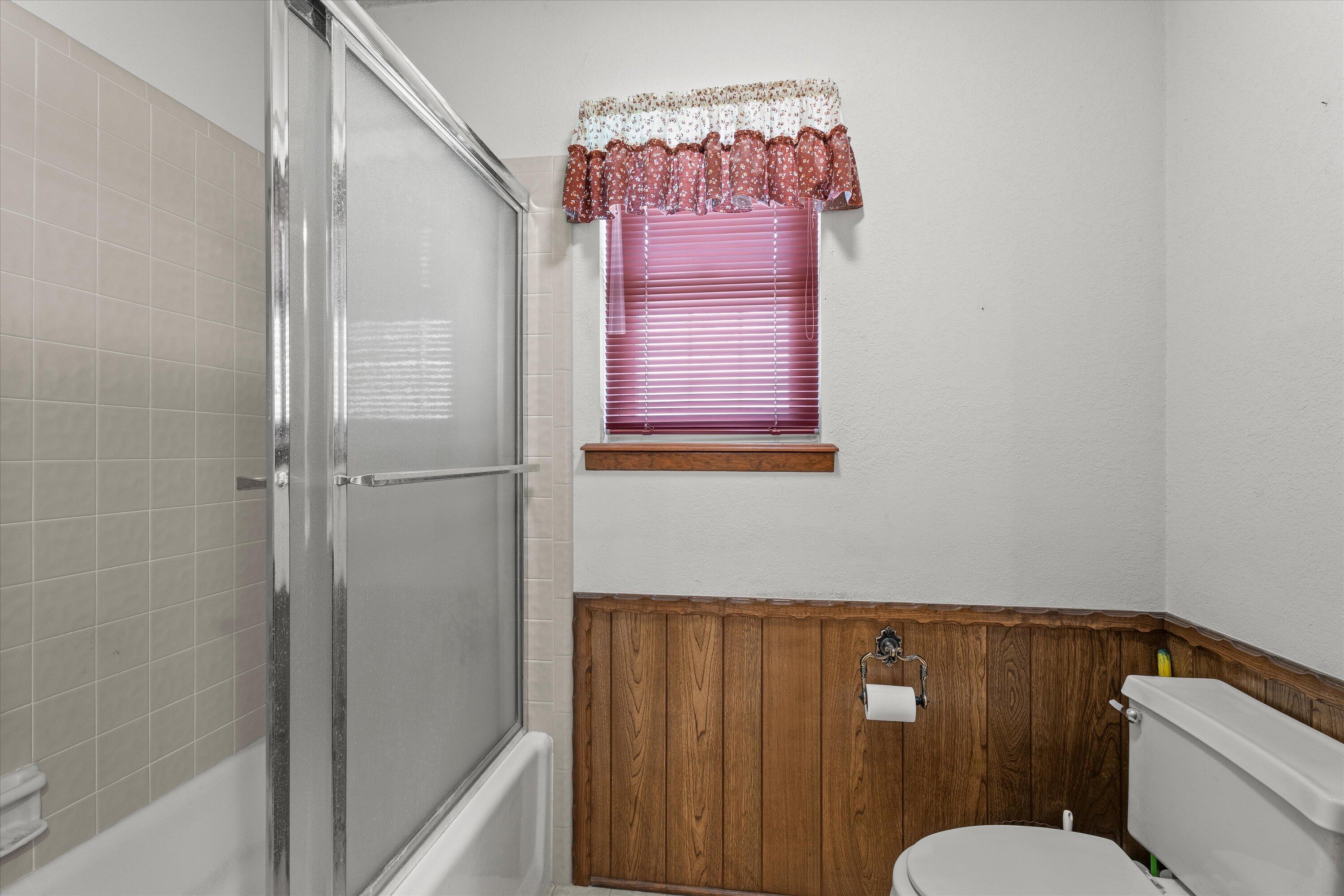 308 West 6th Street Sundown, TX 79372 - Photo 21 of 33 a bathroom with a shower curtain and a sink
