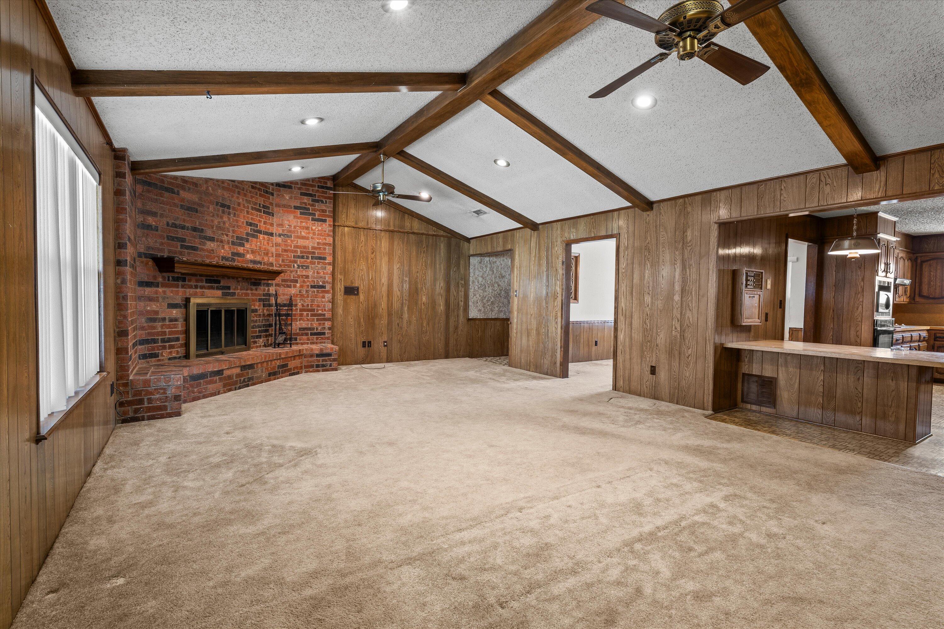 308 West 6th Street Sundown, TX 79372 - Photo 7 of 33 a view of an empty room with a fireplace