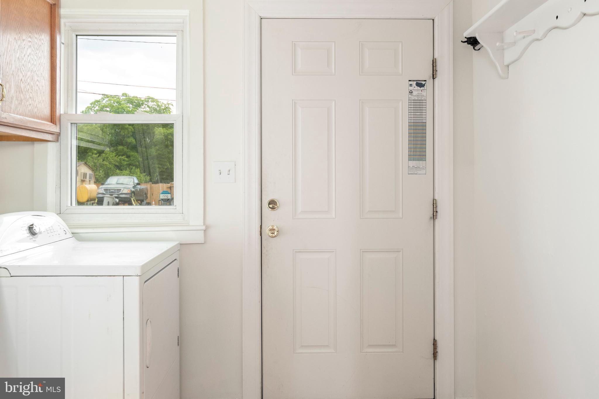 201 Washington Street Cambridge, MD 21613 - Photo 15 of 31 a utility room with a window dryer and washer