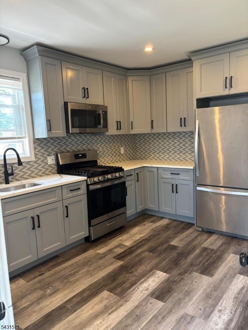 358 Woodland Road, Unit 2 Madison, NJ 07940 - Photo 6 of 50 a kitchen with granite countertop a sink stainless steel appliances and cabinets
