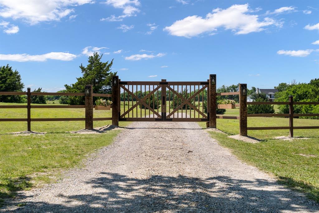 209 Mary Fitch Road Sherman, TX 75090 - Photo 2 of 29 Front Entrance Gate gravel driveway to home.