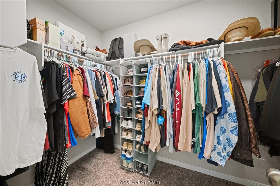 203 36th Ridge Caldwell, TX 77836 - Photo 16 of 31 a view of walk in closet with clothes and shoes