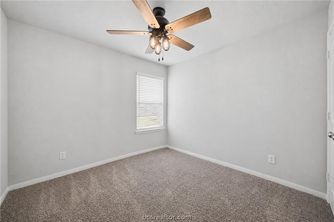 203 36th Ridge Caldwell, TX 77836 - Photo 18 of 31 an empty room with a window and a fan