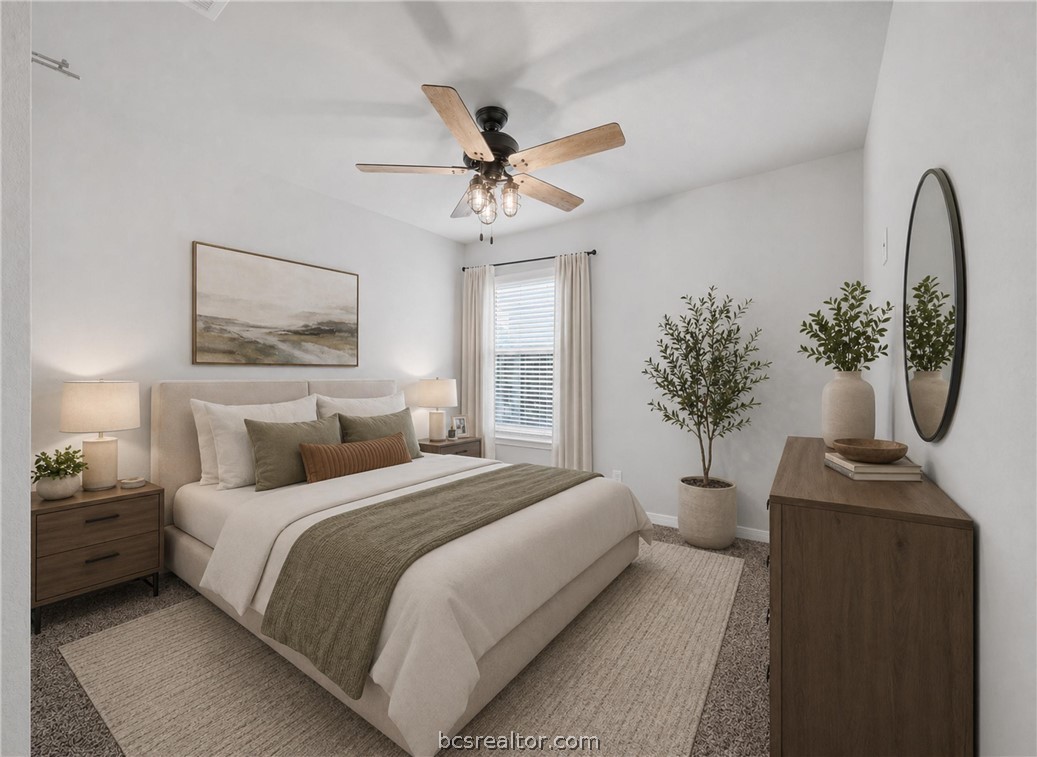 203 36th Ridge Caldwell, TX 77836 - Photo 20 of 31 a bedroom with a large bed and a chandelier