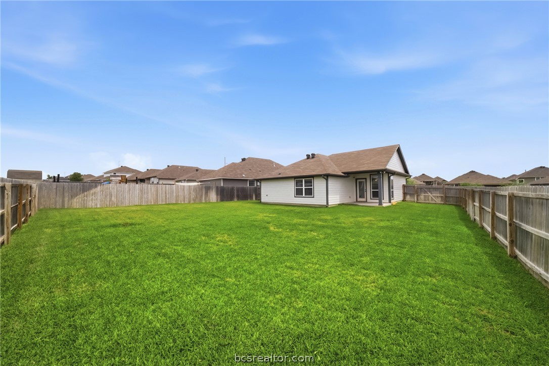 203 36th Ridge Caldwell, TX 77836 - Photo 6 of 31 a view of a big house with a big yard and large trees