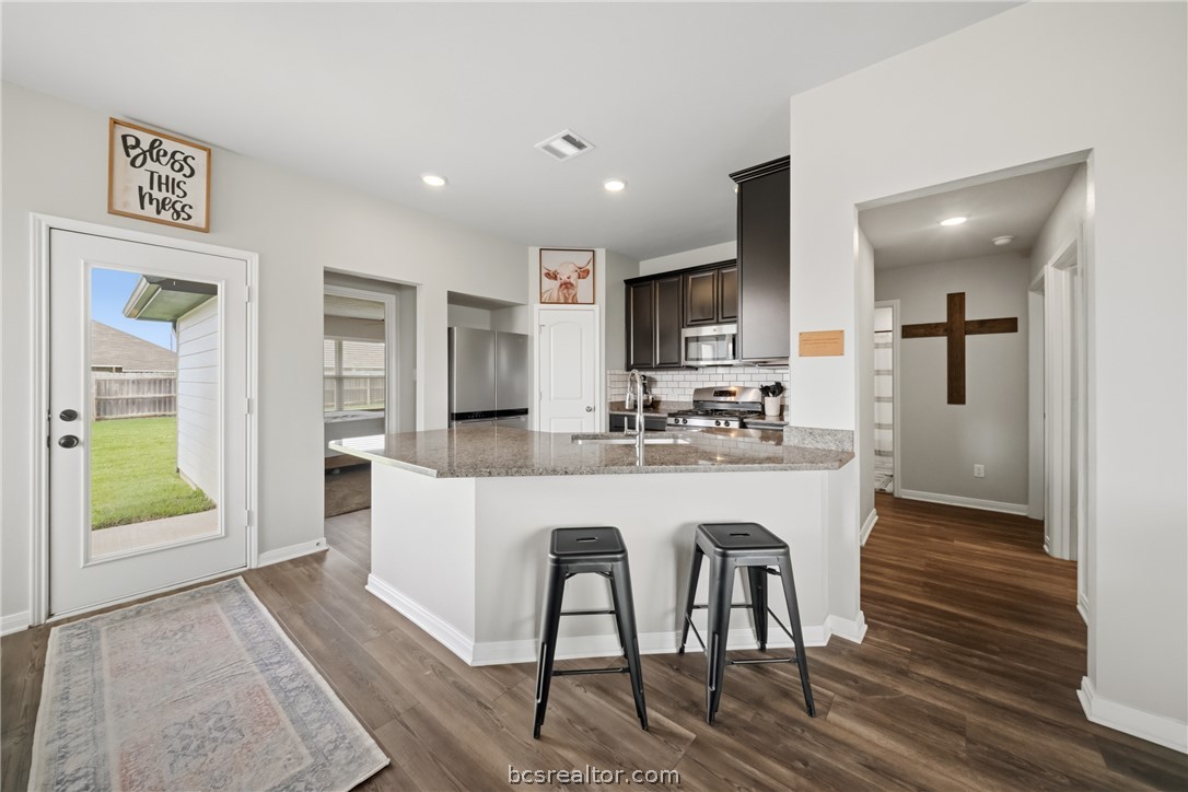 203 36th Ridge Caldwell, TX 77836 - Photo 8 of 31 a large white kitchen with a table and chairs