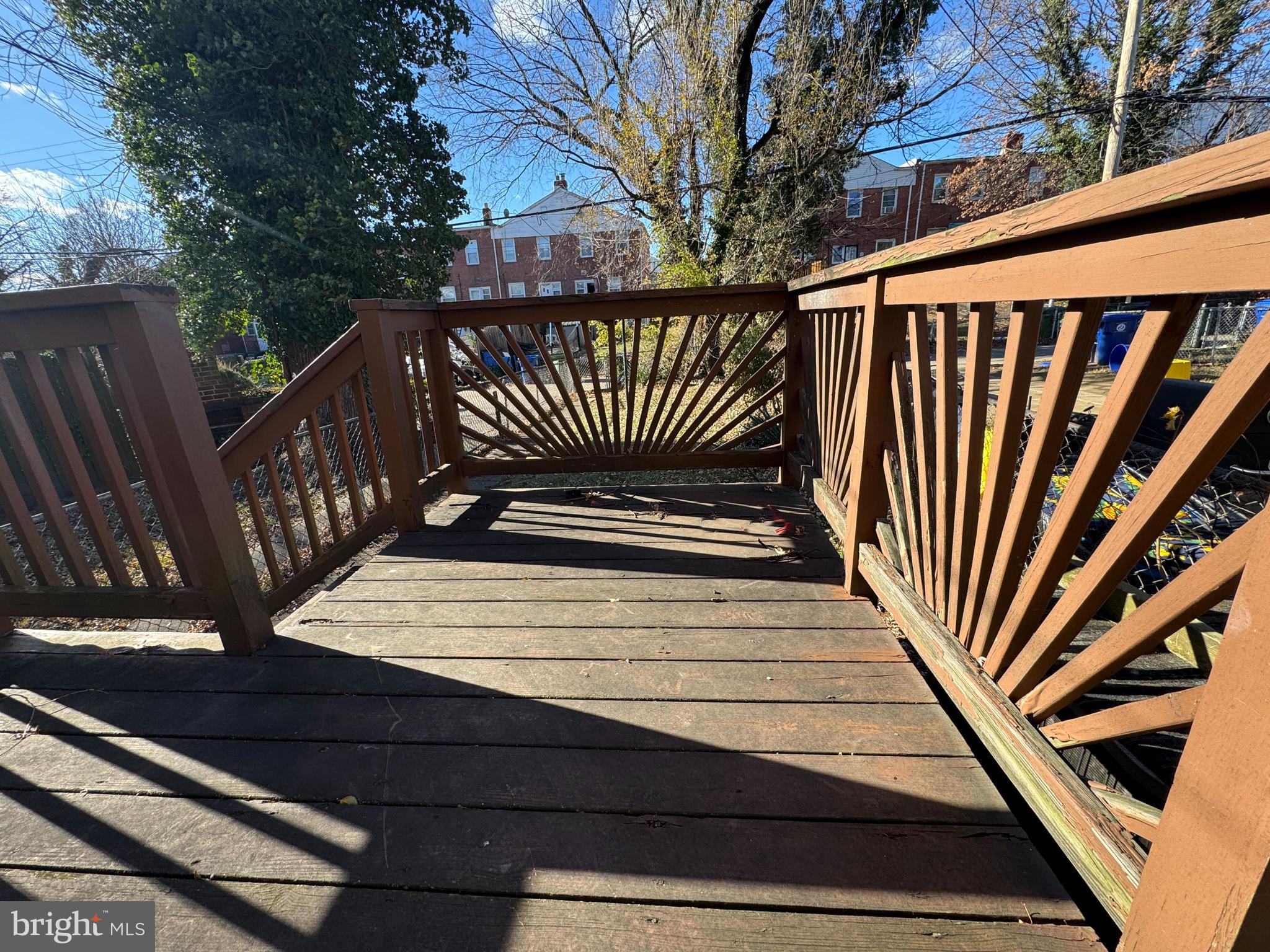 44 North Athol Avenue Baltimore, MD 21229 - Photo 11 of 18 a view of deck with wooden floor and fence
