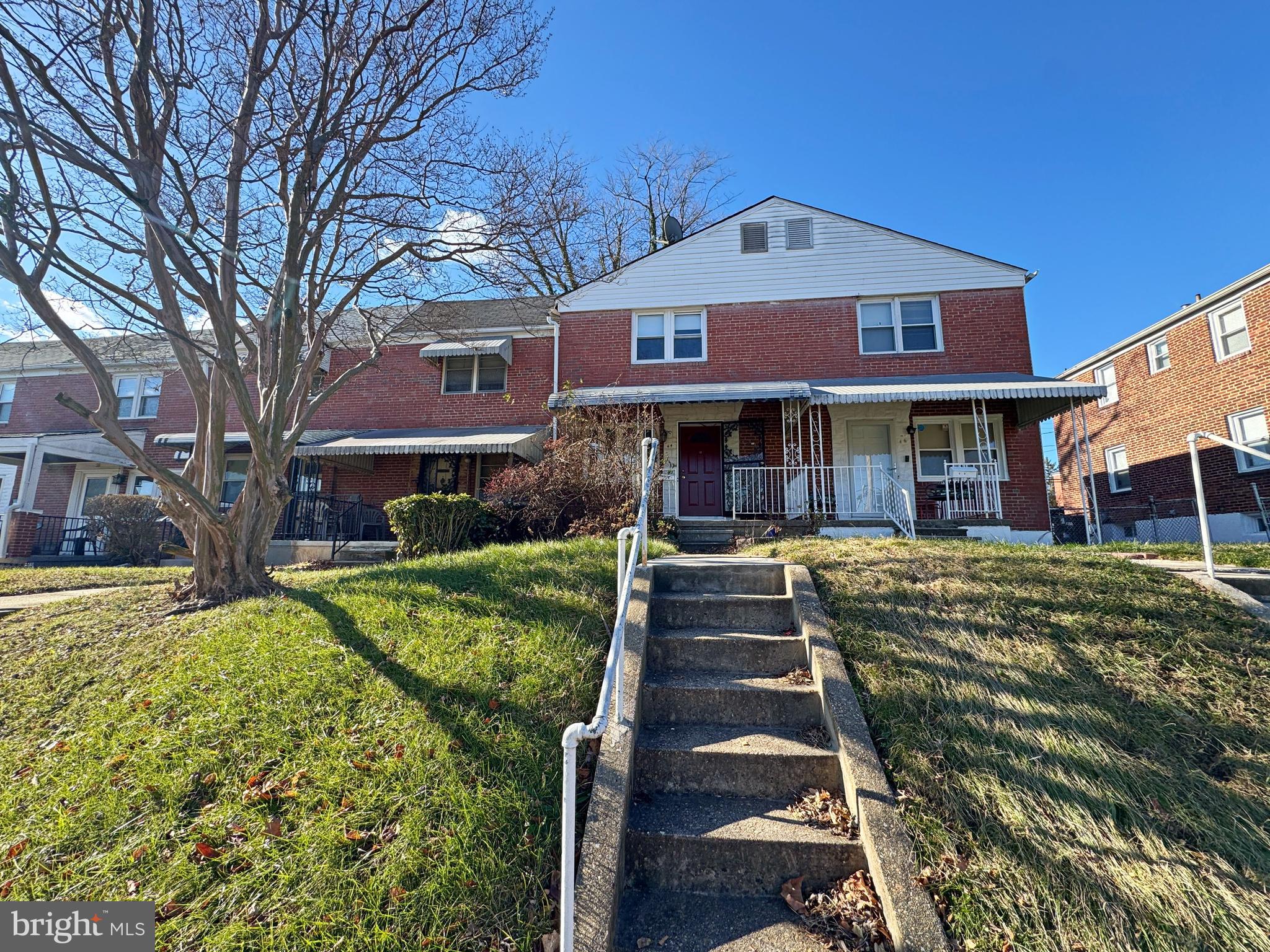 44 North Athol Avenue Baltimore, MD 21229 - Photo 2 of 18 a front view of a house with a yard
