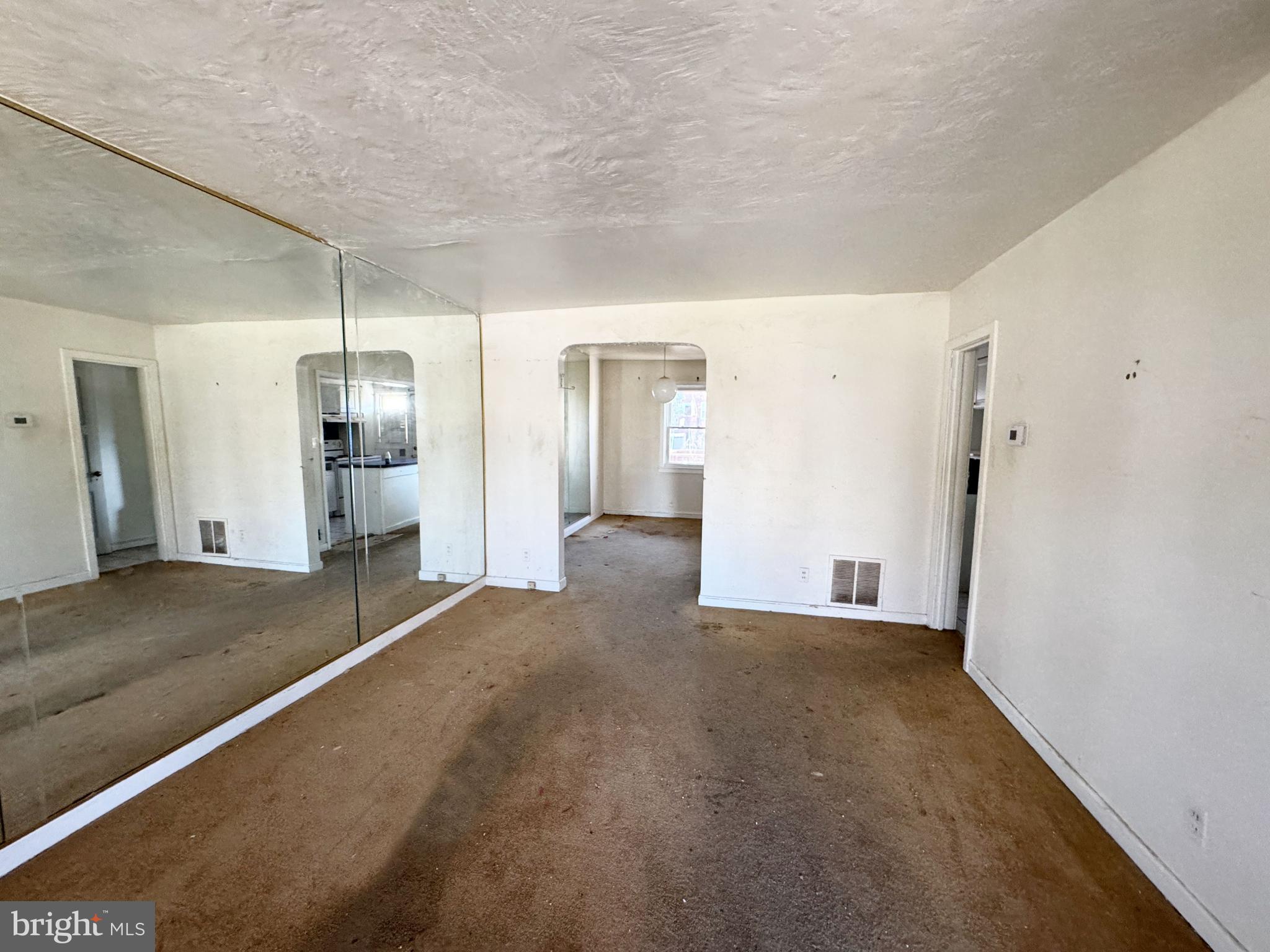 44 North Athol Avenue Baltimore, MD 21229 - Photo 6 of 18 a view of a big room with closet and wooden floor