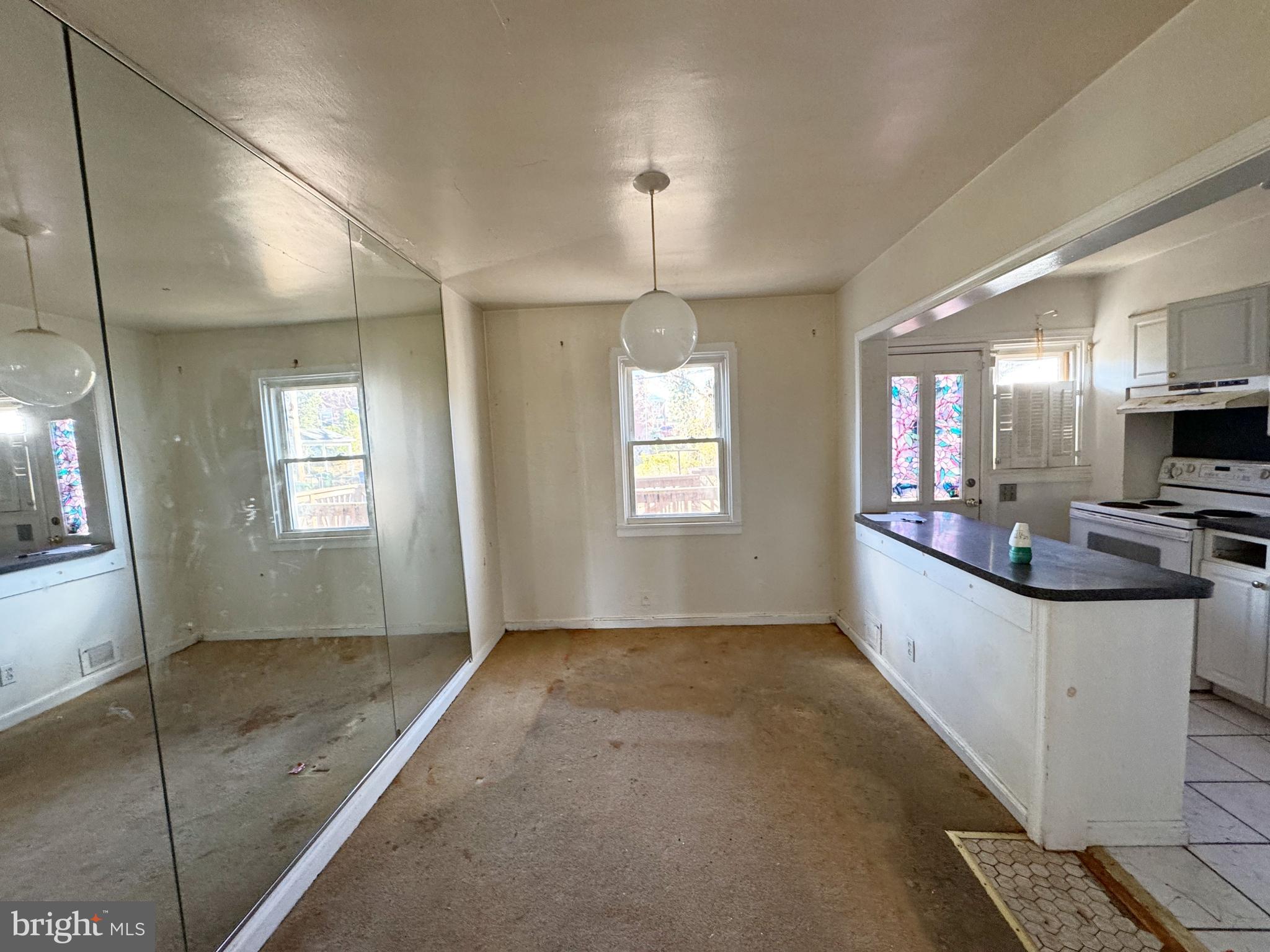 44 North Athol Avenue Baltimore, MD 21229 - Photo 7 of 18 a large white kitchen with kitchen island granite countertop a sink