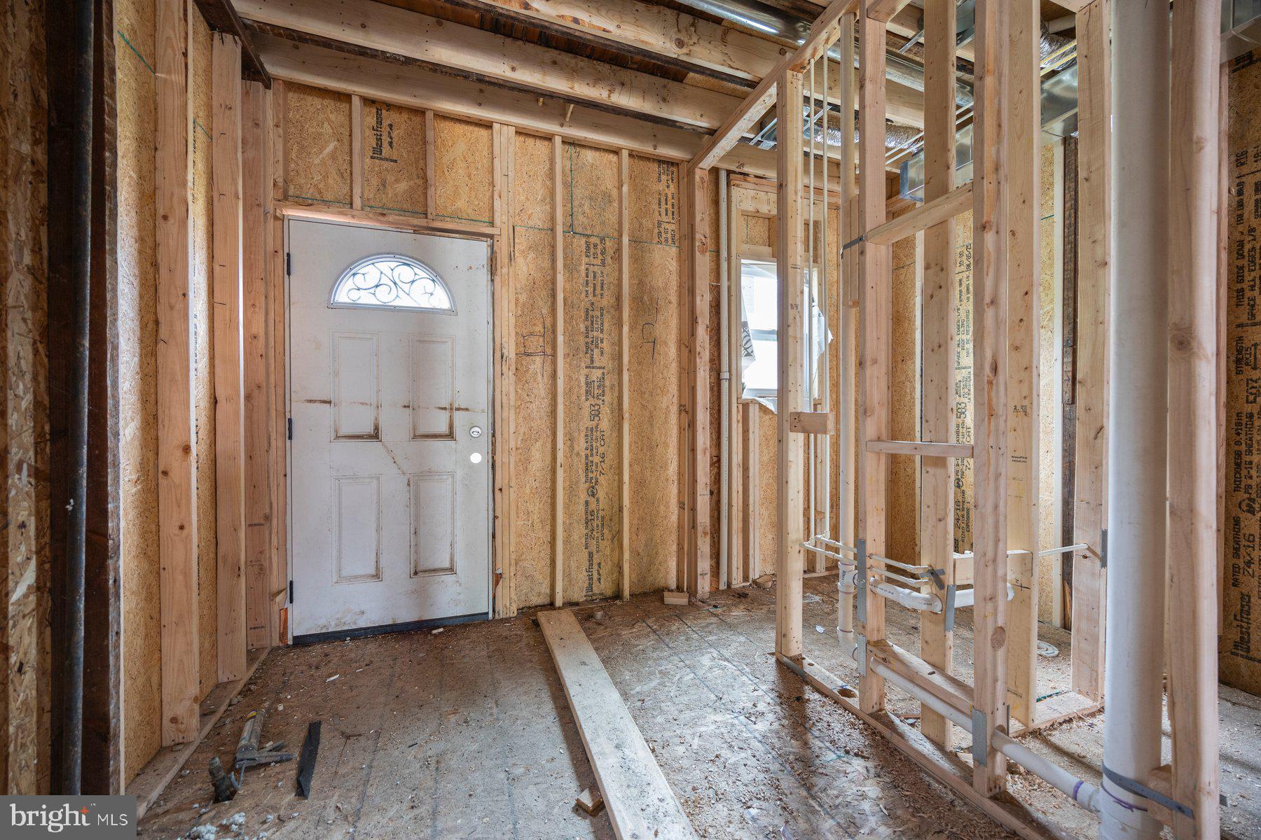 2906 Violet Avenue Baltimore, MD 21215 - Photo 11 of 30 a view of a room with wooden floor and windows