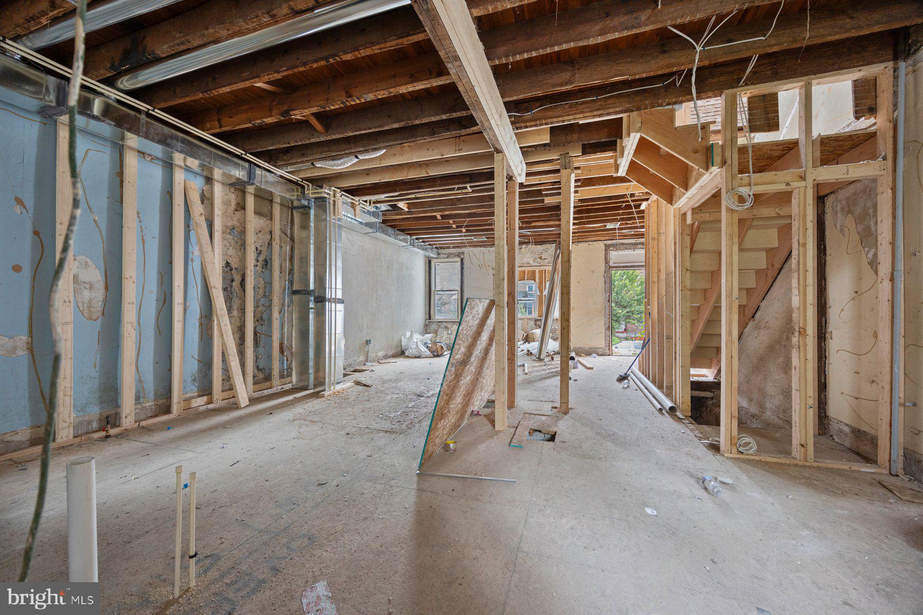 2906 Violet Avenue Baltimore, MD 21215 - Photo 13 of 30 a view of an empty room with stairs