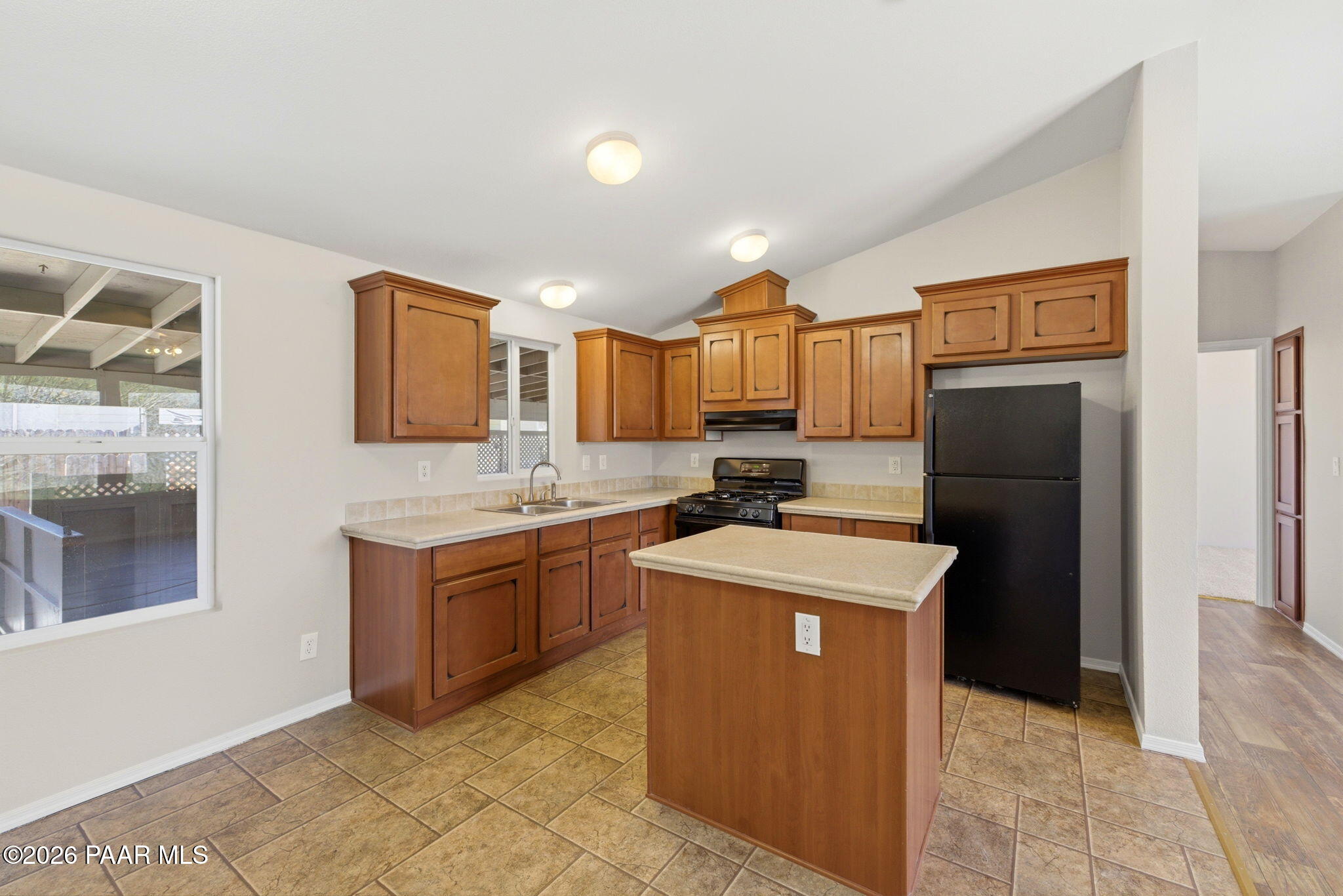10397 East Durham Road Dewey, AZ 86327 - Photo 13 of 40 a kitchen with a sink a stove top oven and refrigerator