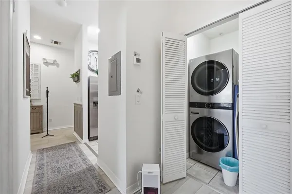 a view of a hallway with washer and dryer