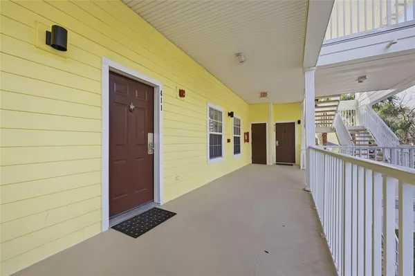 a view of a porch with wooden floor and stairs