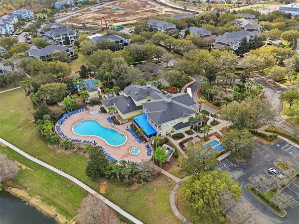 an aerial view of a house with a swimming pool yard and outdoor seating
