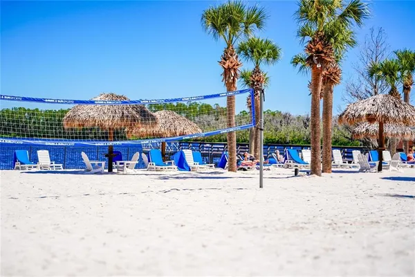 a view of a terrace with a bench and trees