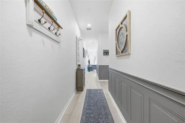 a hallway with wooden floor