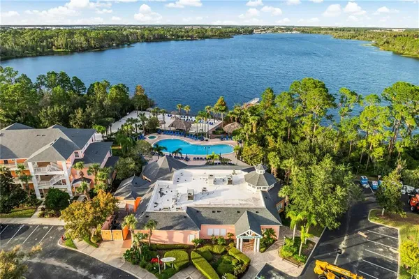 an aerial view of a house with a lake view