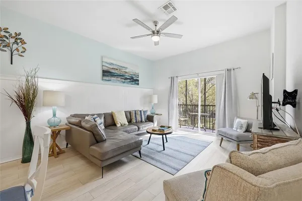 a living room with furniture and a large window