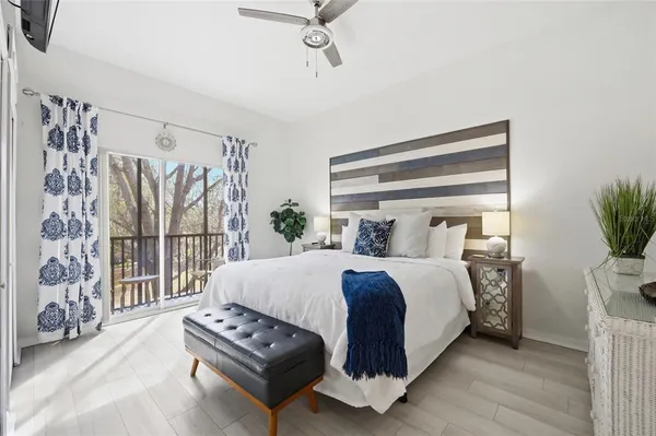 a bedroom with a bed with window