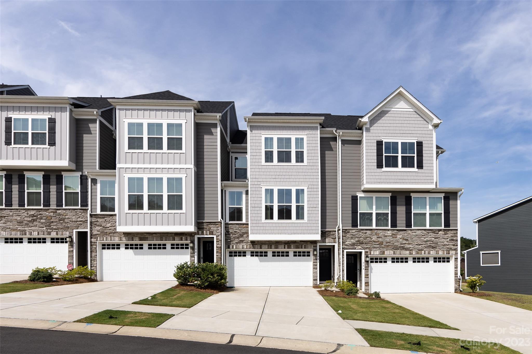 606 Crudent Road Tega Cay, SC 29708 - Photo 1 of 47 a front view of a residential apartment building with a yard