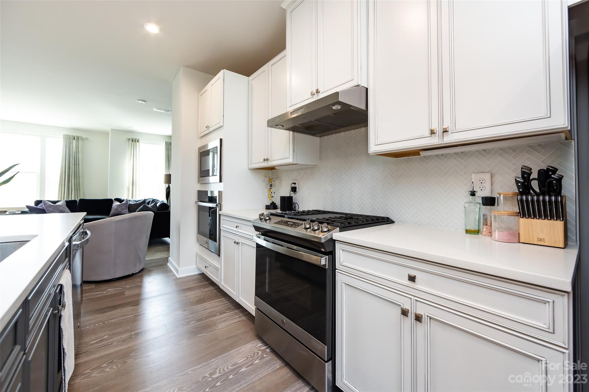 606 Crudent Road Tega Cay, SC 29708 - Photo 12 of 47 a kitchen with stainless steel appliances granite countertop a lot of cabinets a sink and a stove