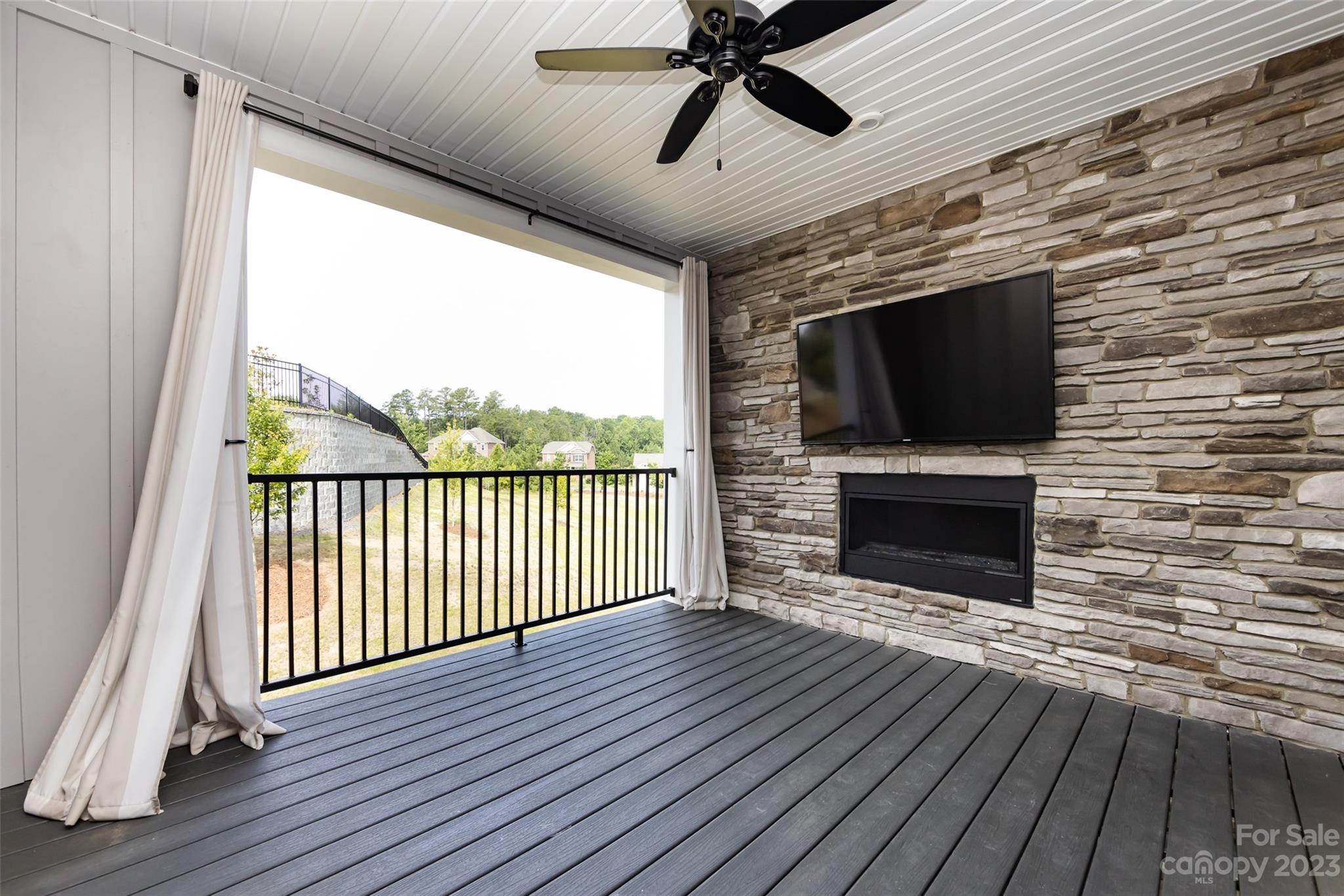606 Crudent Road Tega Cay, SC 29708 - Photo 17 of 47 a view of a livingroom with wooden floor and a fireplace