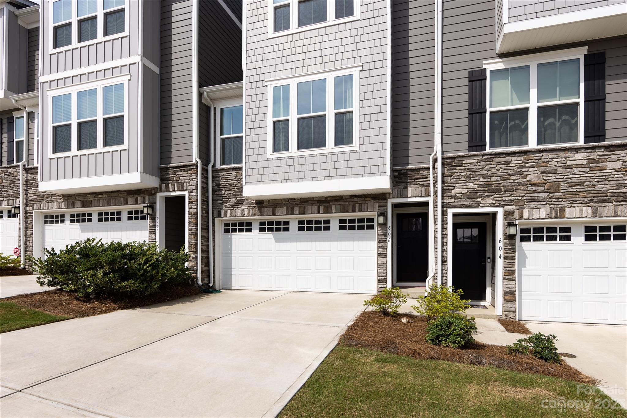 606 Crudent Road Tega Cay, SC 29708 - Photo 2 of 47 a front view of a building with a garden