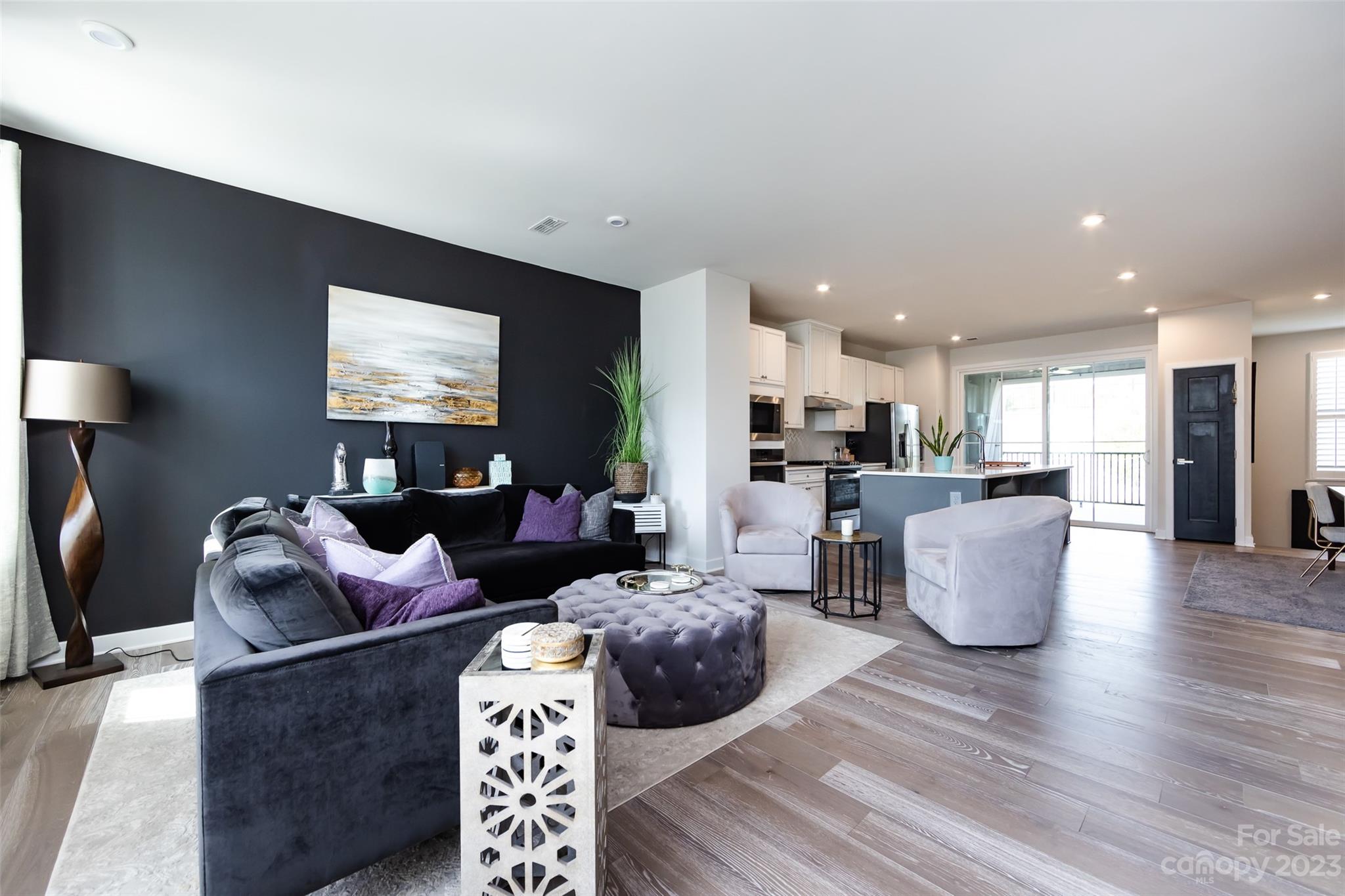 606 Crudent Road Tega Cay, SC 29708 - Photo 22 of 47 a living room with furniture and a flat screen tv