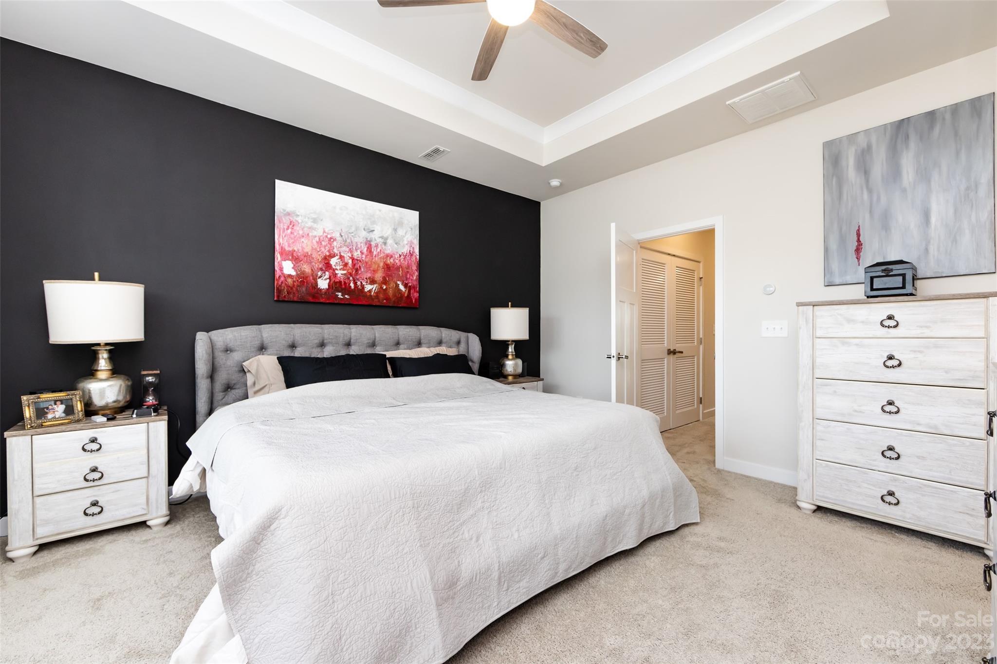 606 Crudent Road Tega Cay, SC 29708 - Photo 26 of 47 a bedroom with a bed and large mirror