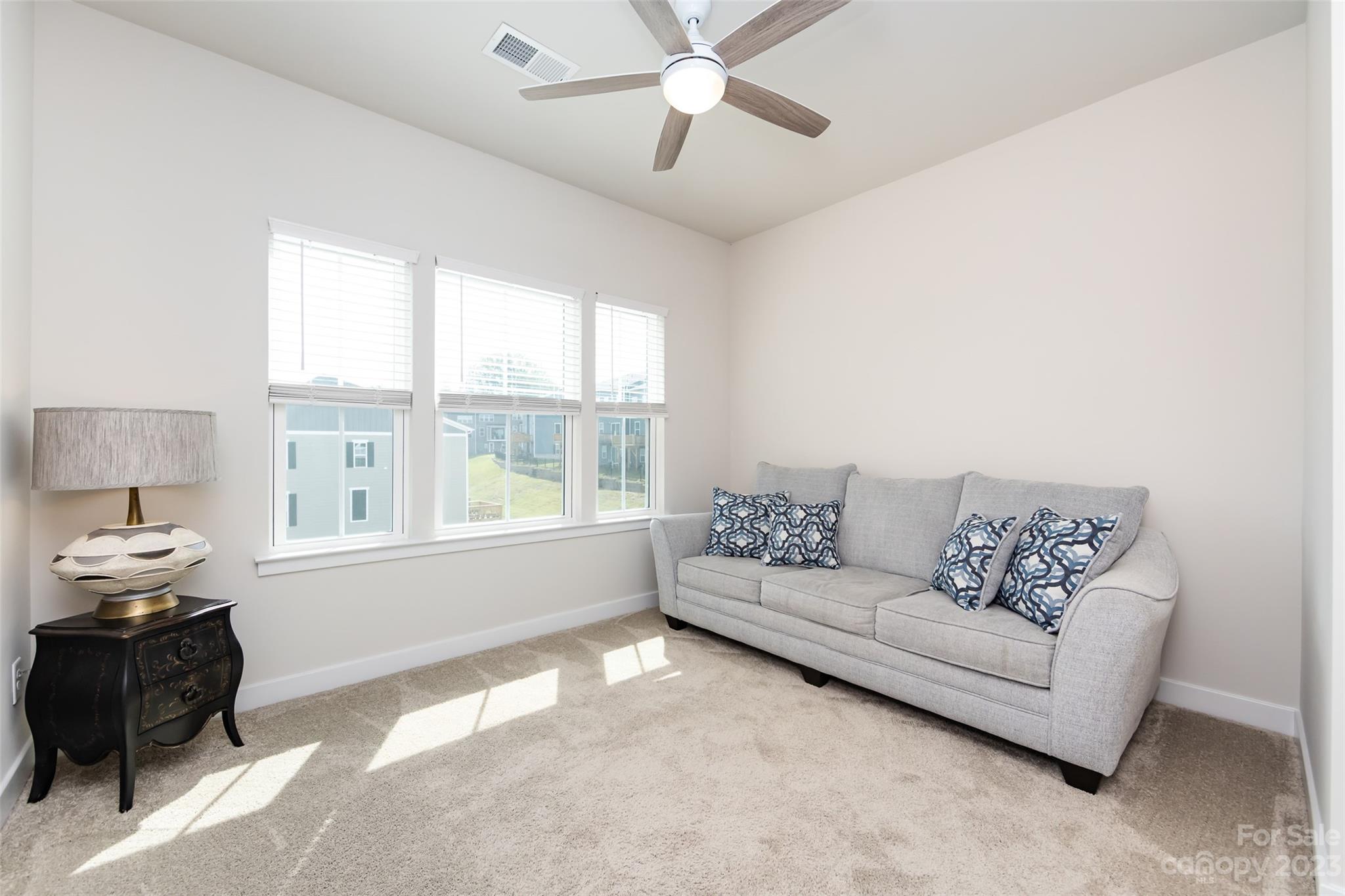 606 Crudent Road Tega Cay, SC 29708 - Photo 34 of 47 a living room with furniture and a window