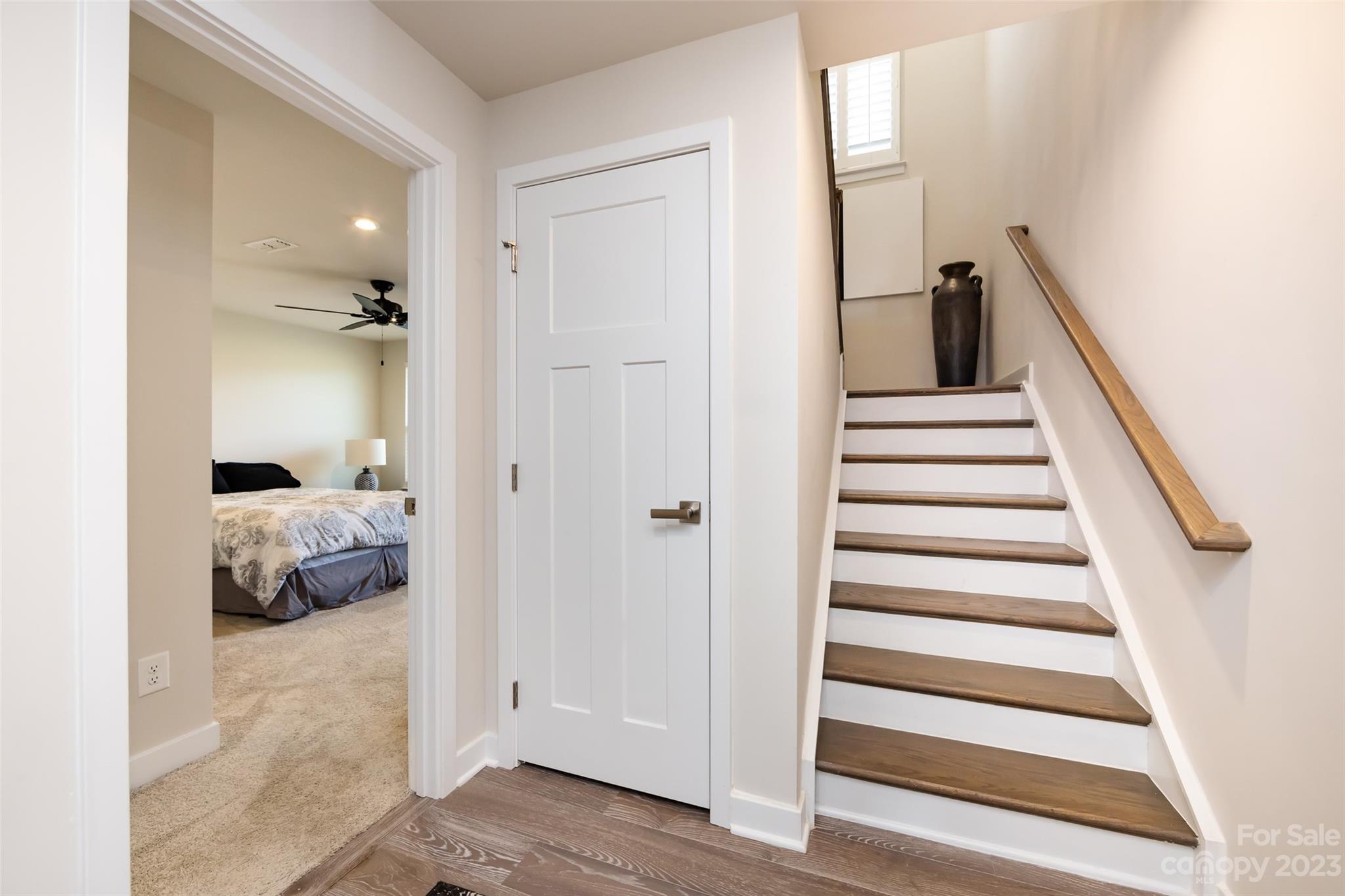 606 Crudent Road Tega Cay, SC 29708 - Photo 36 of 47 a view of a bedroom with wooden floor and windows