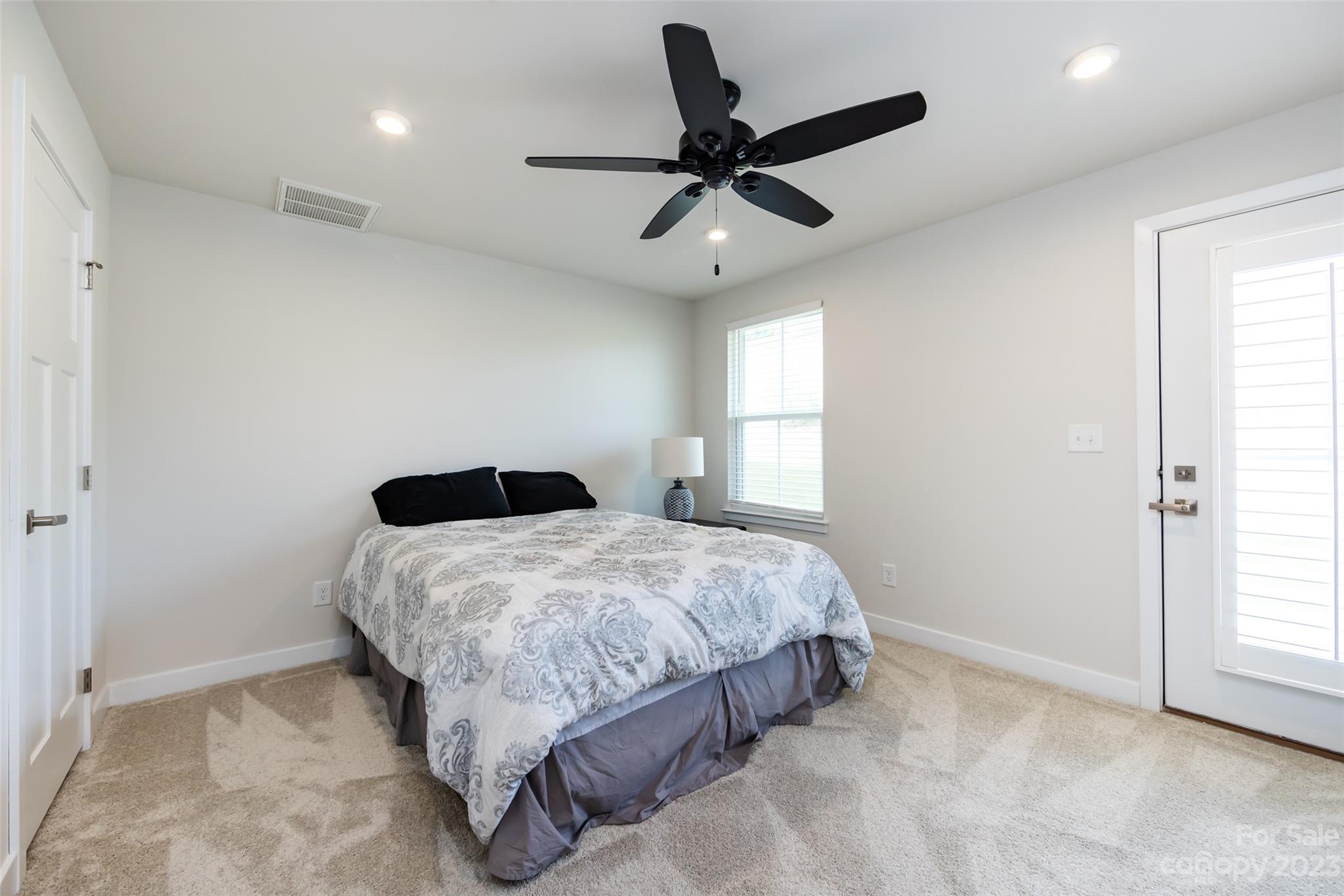 606 Crudent Road Tega Cay, SC 29708 - Photo 38 of 47 a bedroom with a bed and window