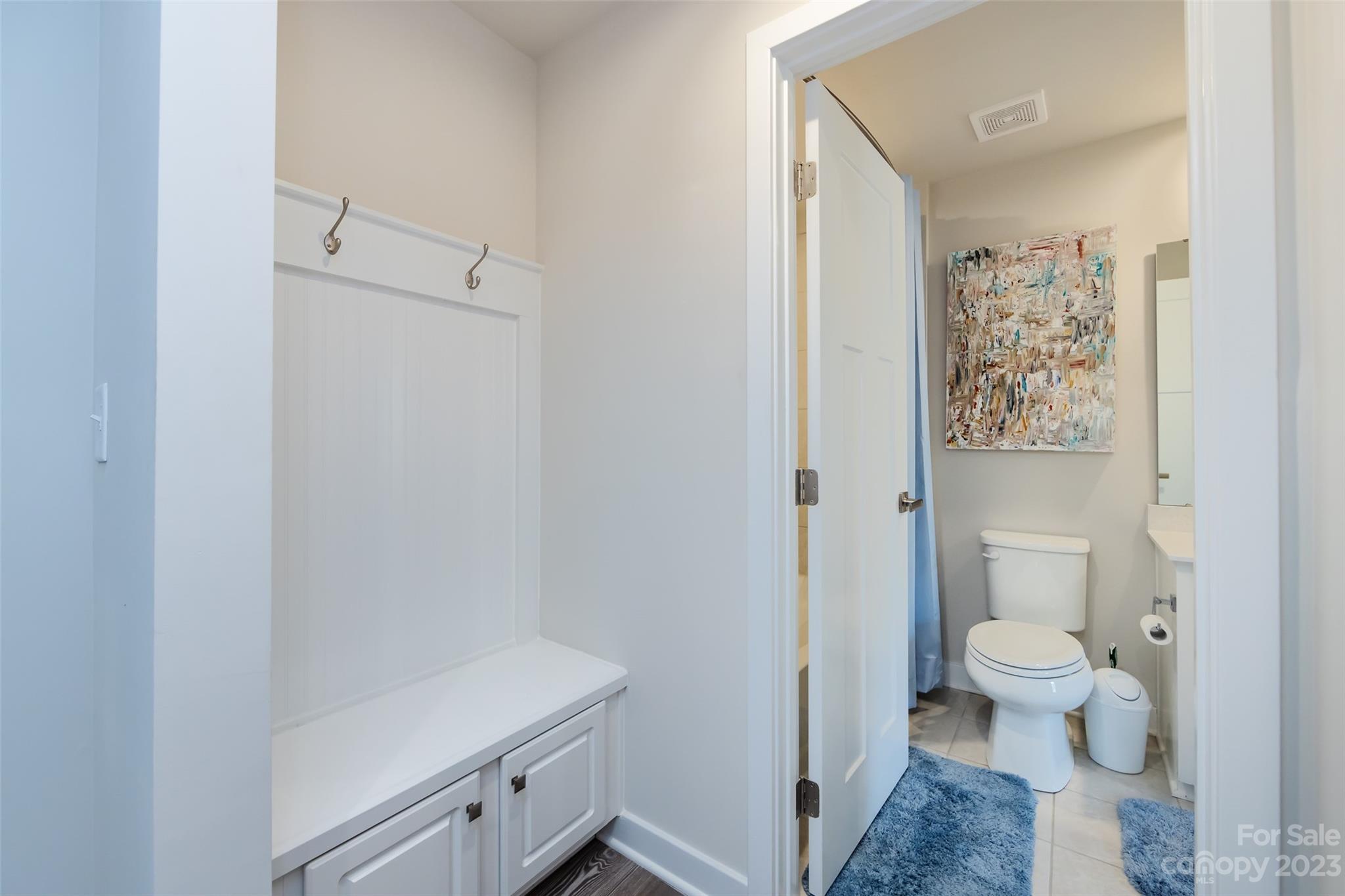 606 Crudent Road Tega Cay, SC 29708 - Photo 41 of 47 a bathroom with a toilet sink and vanity