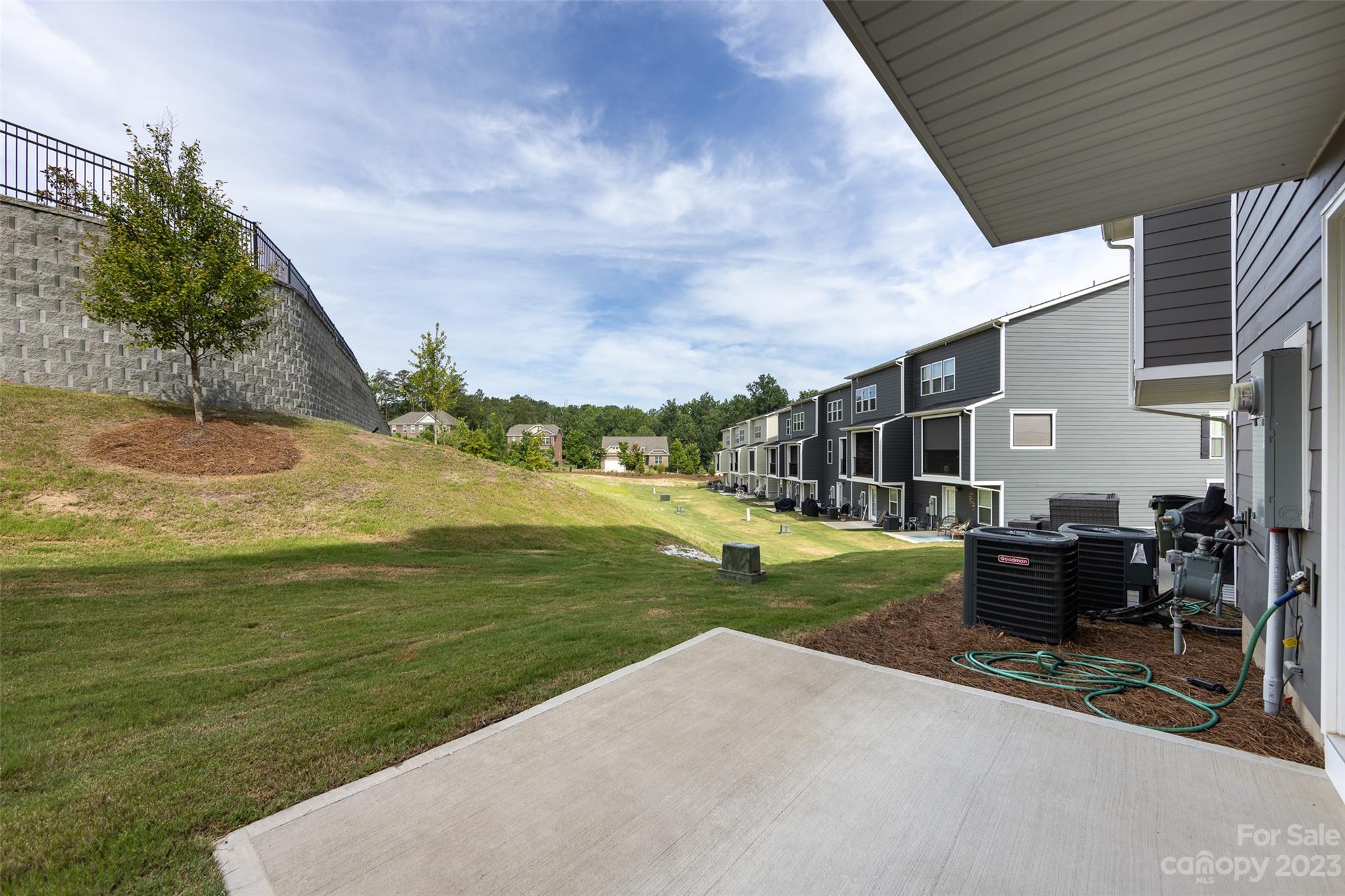 606 Crudent Road Tega Cay, SC 29708 - Photo 46 of 47 a view of a patio with a table and chairs