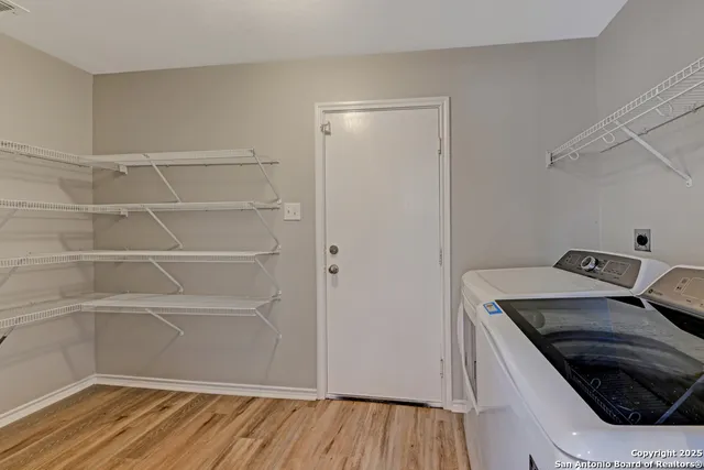 a kitchen with a cabinets and wooden floor