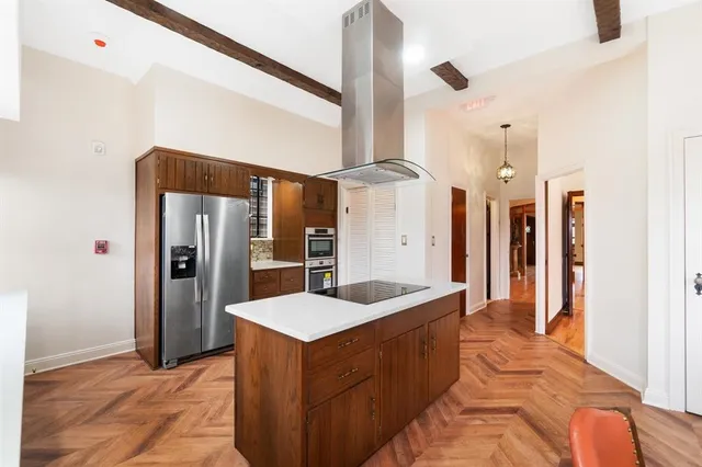a view of a dining room with furniture and a chandelier