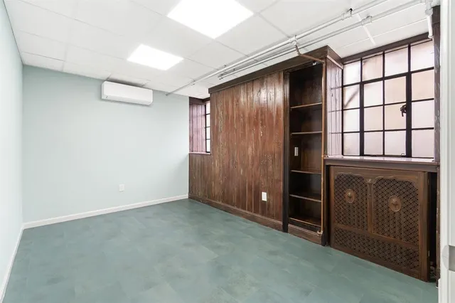 an empty room with closet area