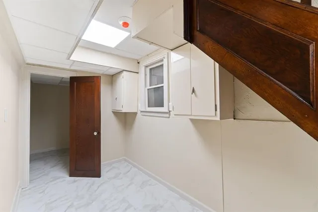 a kitchen with a sink and a refrigerator
