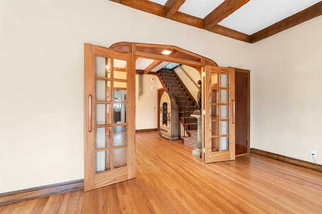 a view of an entryway with wooden floor