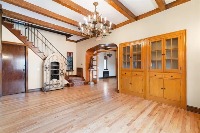 a view of an entryway with wooden floor