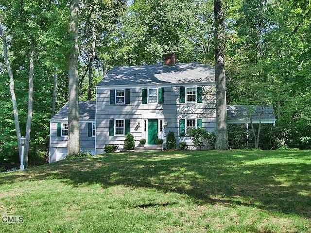27 Briar Brae Road Darien, CT 06820 - Photo 1 of 1 a front view of a house with a garden
