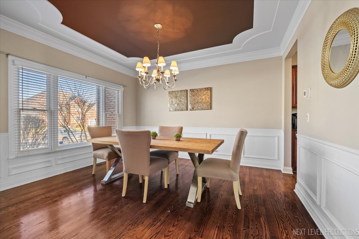 2197 Red Maple Lane Aurora, IL 60502 - Photo 15 of 48 a view of a dining room with furniture window and wooden floor