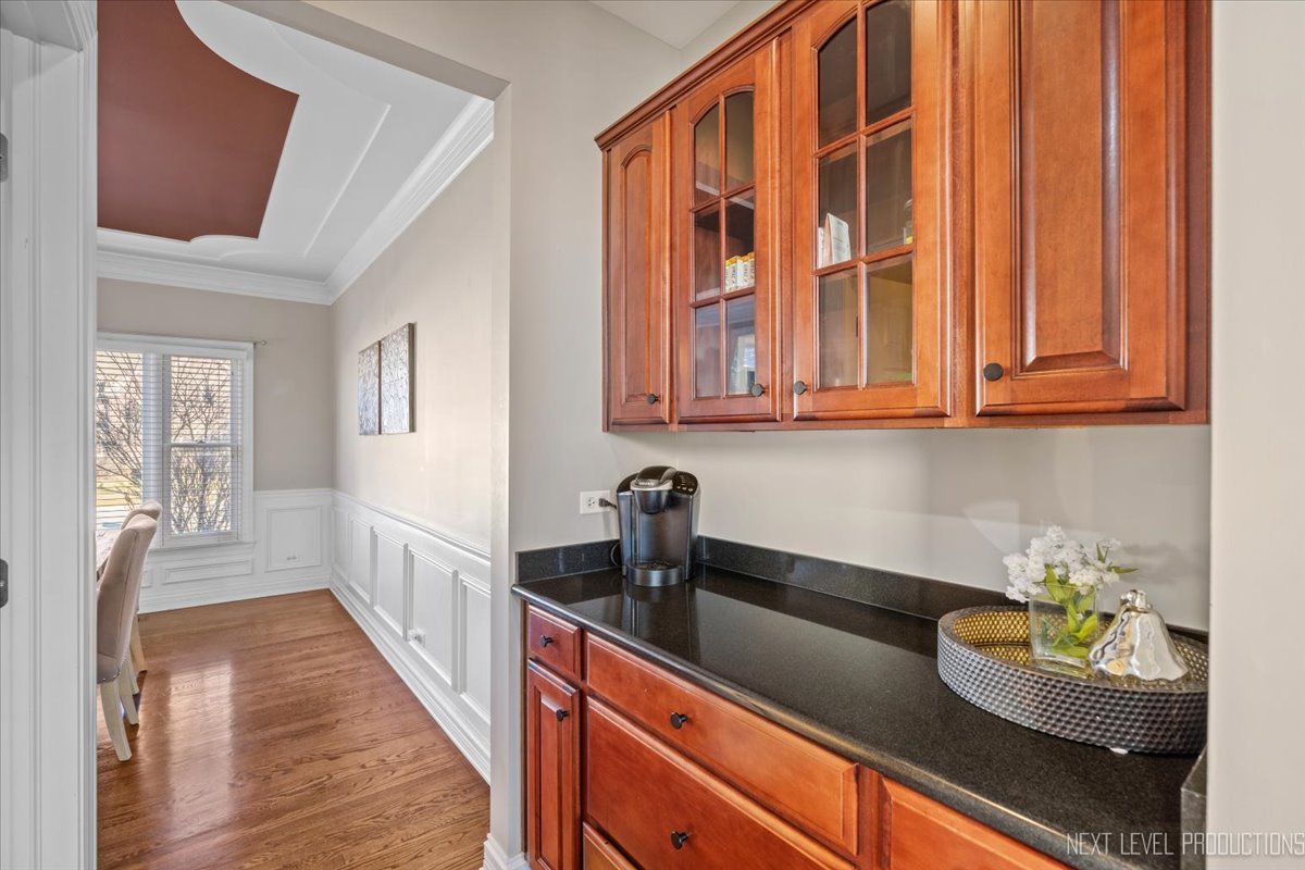 2197 Red Maple Lane Aurora, IL 60502 - Photo 16 of 48 a kitchen with stainless steel appliances granite countertop a sink dishwasher stove and cabinets with wooden floor