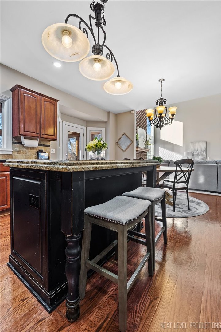 2197 Red Maple Lane Aurora, IL 60502 - Photo 18 of 48 a kitchen with a table and chairs in it