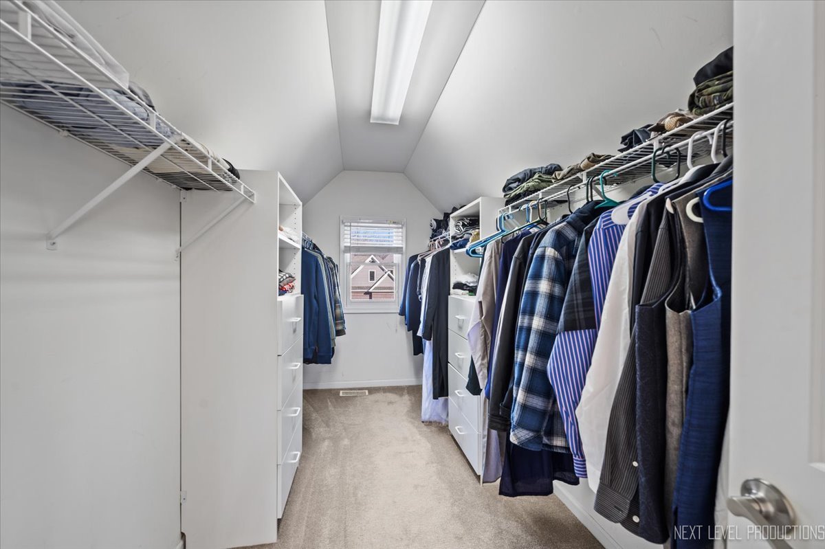 2197 Red Maple Lane Aurora, IL 60502 - Photo 25 of 48 a view of walk in closet with clothes and shoes